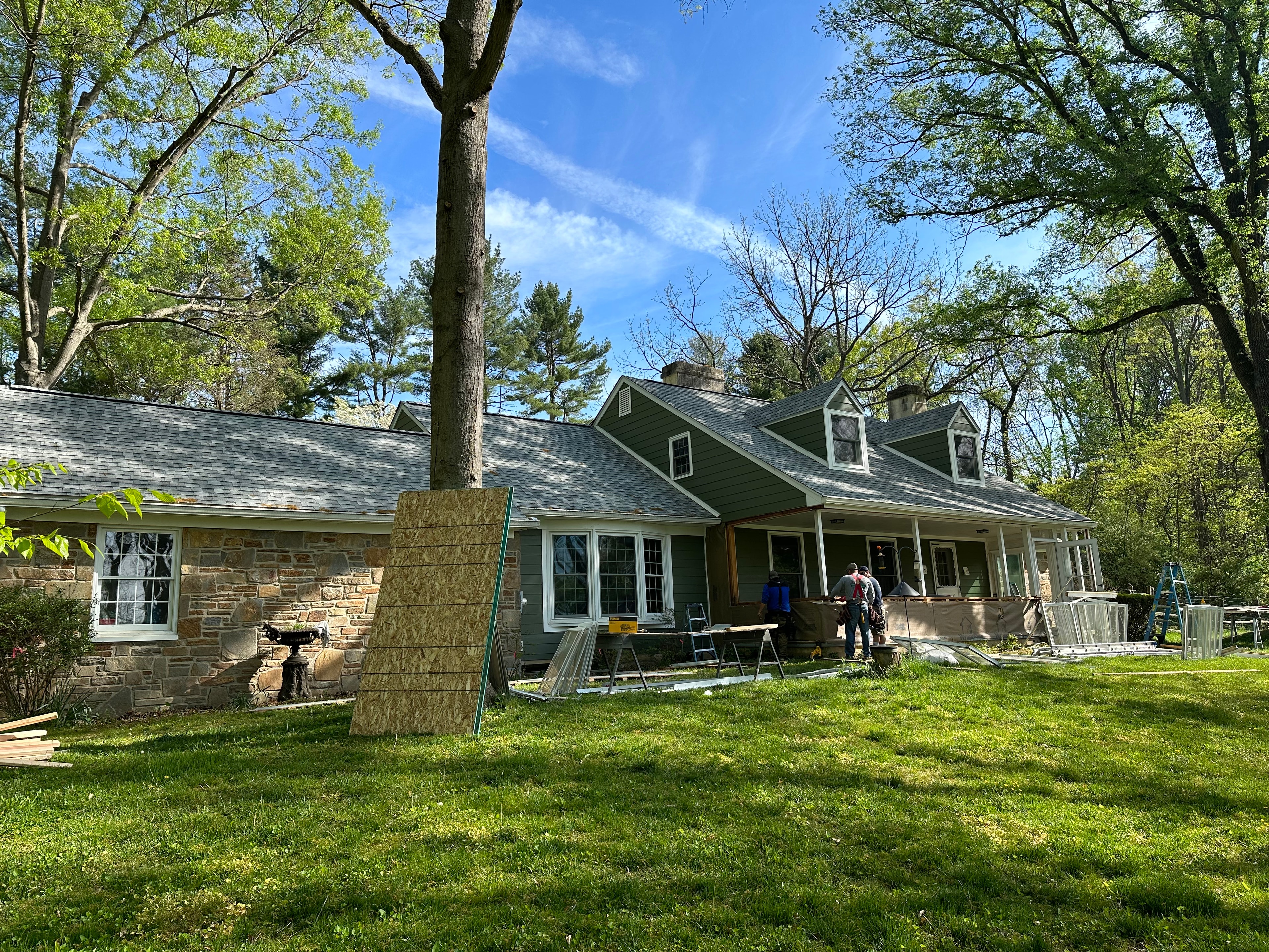 Front of West Chester home showing completed Sierra Grey roof, Mountain Sage Hardie siding, and original stone accent wall